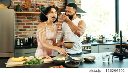 Happy couple, wellness and tasting in apartment for nutrition, together with spoon for healthy diet. Man, woman and breakfast with fruit in house for morning date, excited for cooking in kitchen 116296302
