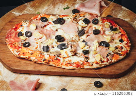 Savory Delight: Ham and Olive Pizza on Wooden Board Savory Delight: Ham and Olive Pizza on Wooden Board 116296398