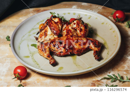 Savory Grilled Chicken Delight,A plate filled with succulent grilled chicken Savory Grilled Chicken Delight,A plate filled with succulent grilled chicken 116296574