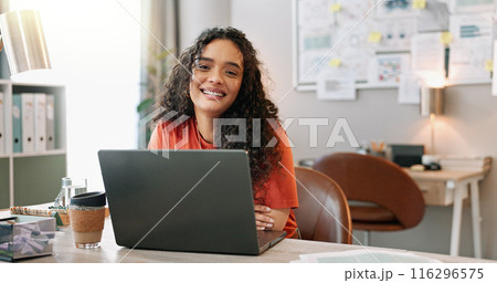 Portrait, woman and smile at desk with laptop, communication and update in office. Female journalist, confident and happy at computer for article, social media and contact in modern workplace in city 116296575