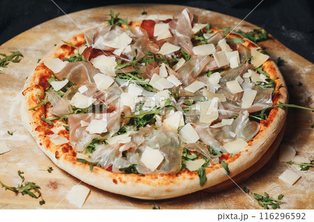 Gastronomic Delight: Pizza With Parmesan Cheese and Arugula Gastronomic Delight: Pizza With Parmesan Cheese and Arugula 116296592