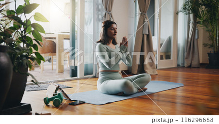 Home, tablet and woman with meditation on mat for inner peace, balance and mindfulness podcast. Calm, person and zen with spiritual healing audio for holistic exercise, awareness or chakra connection 116296688
