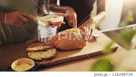 Kitchen, butter and hands of people with bread on counter with slice for sandwich, breakfast and meal. Food, baking and baked goods, roll and loaf for wellness, eating and carbohydrates in home 116296739