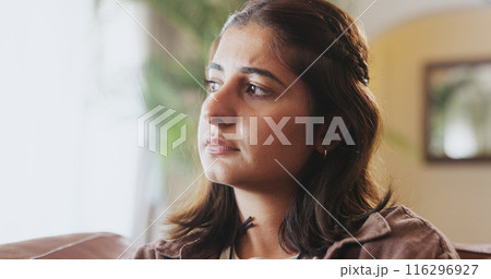 Mental health, thinking and girl with depression, sad and unhappy on sofa in living room, house and home. Anxiety, emotional and concerned woman with stress, moody and miserable person on couch 116296927