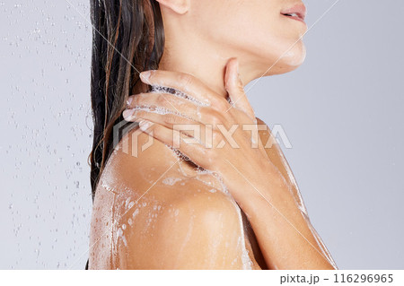 Woman, shower and soap in studio for washing, cleaning and beauty for cosmetics or hygiene. Female person, skincare and foam on white background, water splash and refreshing liquid for dermatology Woman, shower and soap in studio for washing, cleaning and beauty for cosmetics or hygiene. Female person, skincare and foam on white background, water splash and refreshing liquid for dermatology 116296965