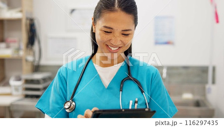 Happy, asian woman and veterinarian with tablet for research on animal medicine, study or browsing at clinic. Young female person or veterinary scrolling on technology with smile for medical search 116297435