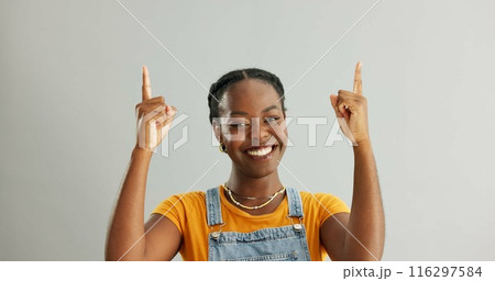 Portrait, pointing and black woman in studio for college registration, notification or information on gray background. Mockup, smile and person with hand gesture for opportunity, advice or decision 116297584