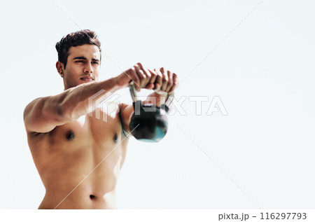 Man, stretching and kettlebell fitness in park for strength, bodybuilding routine and training. Weightlifting, metal equipment and exercising person with bodybuilder, workout and health for muscles 116297793