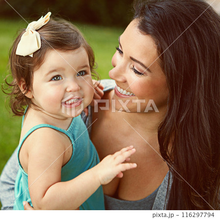 Happy, toddler and woman with love in nature for outdoor fun, care and motherhood on weekend. Summer, baby girl and mom with smile in garden for growth, bonding and support in child development 116297794