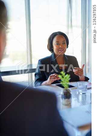 Meeting, hiring and business woman with candidates in office for recruitment discussion. Interview, conversation and female hr manager talk to people for onboarding process in workplace boardroom. 116297855