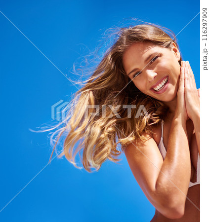 Woman, portrait and bikini on blue sky for summer, vacation and beach smile or outdoor wind mockup. Tourist, nature and Miami for confidence, clean air and weekend travel with swimsuit for low angle Woman, portrait and bikini on blue sky for summer, vacation and beach smile or outdoor wind mockup. Tourist, nature and Miami for confidence, clean air and weekend travel with swimsuit for low angle 116297909