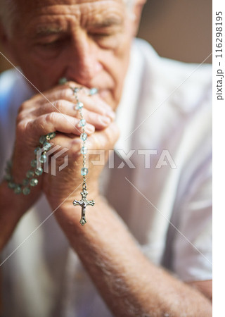 Rosary, God and senior man with praying at home for religious healing, mercy and faith in Jesus. Retirement, peace and elderly person with crucifix for religion, hope and guidance in Holy Spirit 116298195