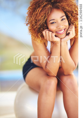 Woman, joy and portrait in home with medicine ball for exercise, workout and satisfied with progress. Female person, house and smile or confident with fitness for health, wellbeing and wellness 116298488