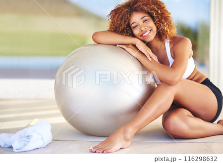 Girl, happy and confident in home with medicine ball for exercise, workout and satisfied with progress. Female person, break and smile or portrait with fitness for health, wellbeing and wellness Girl, happy and confident in home with medicine ball for exercise, workout and satisfied with progress. Female person, break and smile or portrait with fitness for health, wellbeing and wellness 116298632