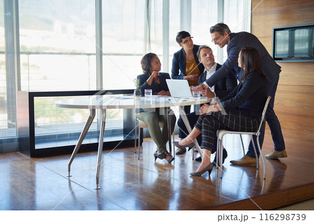 Business, people and laptop in boardroom with strategy or idea on project with teamwork and collaboration. Employee, discussion and office with conversation as partners in law firm, lawyers and plan 116298739