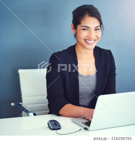 Business woman, portrait and planning on computer with research or typing by wall background. Professional worker in human resources smile for software on laptop with career or project at office desk 116298783