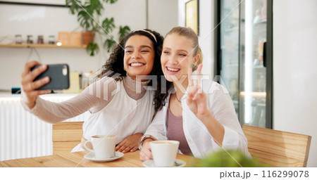 Women, friends and peace sign with coffee for selfie, social media or post on Internet for memories. Female influencers, happy and hand gesture for cafe blog or profile picture and bonding together Women, friends and peace sign with coffee for selfie, social media or post on Internet for memories. Female influencers, happy and hand gesture for cafe blog or profile picture and bonding together 116299078