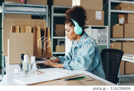 Courier business, woman and laptop in office for ecommerce, online service and manage delivery. Female owner, supplier and computer for typing, digital inventory and headphones for radio podcast Courier business, woman and laptop in office for ecommerce, online service and manage delivery. Female owner, supplier and computer for typing, digital inventory and headphones for radio podcast 116299606