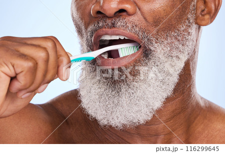Brushing teeth, mouth and man for dental healthcare, studio and oral hygiene on blue background. Whitening, clean or routine with tooth brush for person, closeup or toothpaste for fresh breath Brushing teeth, mouth and man for dental healthcare, studio and oral hygiene on blue background. Whitening, clean or routine with tooth brush for person, closeup or toothpaste for fresh breath 116299645