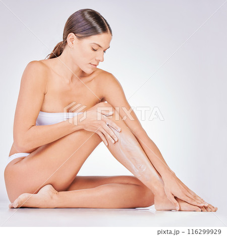 Hair removal, skincare and woman with shaving cream in studio for natural cosmetic, epilation or grooming. Body, legs and model on floor for treatment, wellness or satisfaction on white background. 116299929