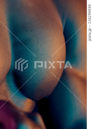 Man, closeup and muscle in studio, shirtless and skin for chest or strong pectoral for fitness. Male person, body and bodybuilder for health, flexing and athlete for topless wellness in dark 116299930