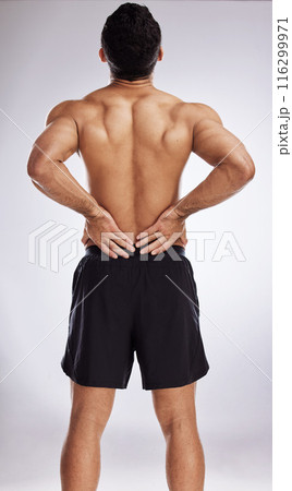 Injury, topless man and holding back pain for spinal stenosis, hurt or training sprain in studio white background. Male person, emergency and body crisis with stress for self care and medical health Injury, topless man and holding back pain for spinal stenosis, hurt or training sprain in studio white background. Male person, emergency and body crisis with stress for self care and medical health 116299971