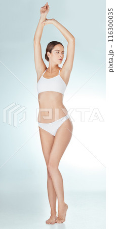 Woman, body and underwear in studio for health, wellness and self care with model aesthetic. Girl, lingerie and natural person with epilation or waxing for slimming transformation on white background 116300035