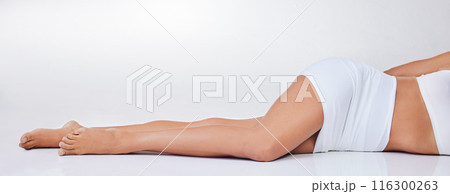 Woman, underwear and legs smooth for cosmetics, skincare and epilation in white studio background. Female person, wax or clean shave relaxing for health, wellness and hygiene or hair removal Woman, underwear and legs smooth for cosmetics, skincare and epilation in white studio background. Female person, wax or clean shave relaxing for health, wellness and hygiene or hair removal 116300263