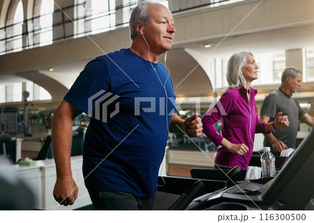 Happy, senior people and running on treadmill for wellness, exercise, and fitness in retirement. Men, woman and friends training in gym for cardio workout, physical vitality and body strength Happy, senior people and running on treadmill for wellness, exercise, and fitness in retirement. Men, woman and friends training in gym for cardio workout, physical vitality and body strength 116300500