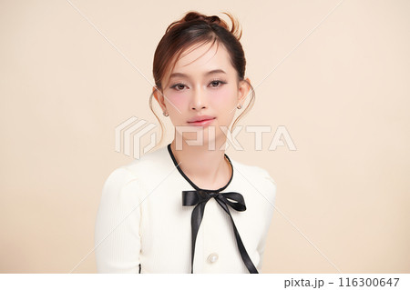 Beautiful young asian woman with clean fresh skin on beige background, Face care, Facial treatment, Cosmetology, beauty and spa, Asian women portrait. Beautiful young asian woman with clean fresh skin on beige background, Face care, Facial treatment, Cosmetology, beauty and spa, Asian women portrait. 116300647