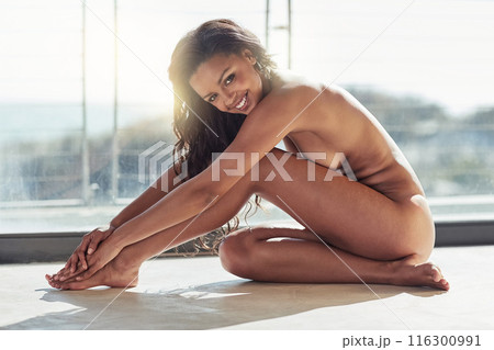 Black woman, naked and portrait for skincare, smile for confidence or alluring in enticing makeup at home. Model, nude and happiness for body, erotic sensual girl and sensuous with gorgeous face 116300991
