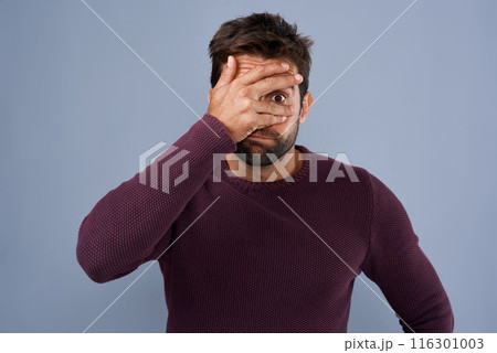 Shame, man and cover of eye, portrait and disappointed of fail of party in elections and headache. Blue background, palm and hand to hide face, embarrassed and sad student in politics and unhappy 116301003