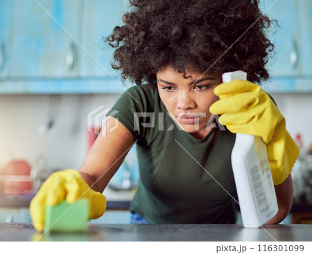 Home, spray and woman with cleaning on table for hygiene, housekeeping and maintenance in kitchen. Person, detergent and bottle with gloves in house for bacteria, sanitation and removal of dirt 116301099