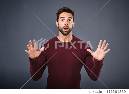 Gray background, shock and portrait of man, studio and wow with hands, mouth and amazed by announcement. Face, employee and person with surprise for bonus, designer and raise in work and Canada 116301280