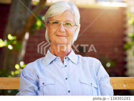 Woman, senior and smile portrait or outside relaxing, garden bench and happy for retirement or wellness. Nursing home, elderly female person and pensioner, fresh air and break in summer in park 116301281