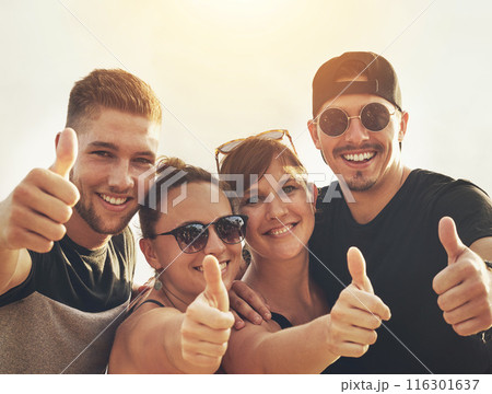 Portrait, friends and thumbs up happy outdoor together for community, celebration and fun summer memories. Smiling, people or group excited outside in agreement for adventure, support and travelling 116301637