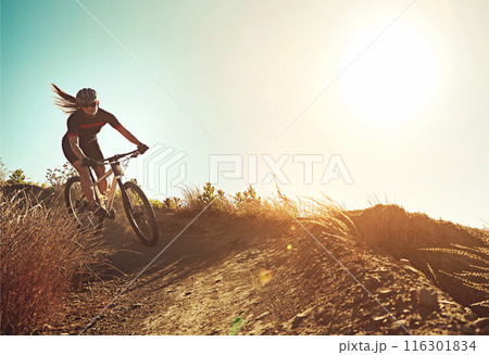 Morning, woman and mountain bike with fitness, training and extreme sport on hill and dirt path. Bicycle, cycling and cardio of athlete with nature and exercise for race workout outdoor with mockup Morning, woman and mountain bike with fitness, training and extreme sport on hill and dirt path. Bicycle, cycling and cardio of athlete with nature and exercise for race workout outdoor with mockup 116301834