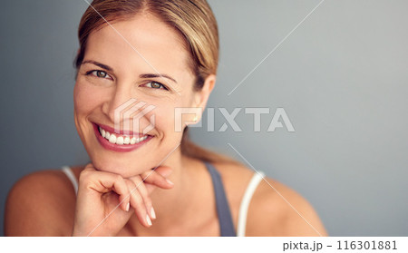 Portrait, smile and woman with fitness, wellness and healthy person on grey studio background. Face, model and athlete with balance, mockup space and exercise with training, progress and challenge Portrait, smile and woman with fitness, wellness and healthy person on grey studio background. Face, model and athlete with balance, mockup space and exercise with training, progress and challenge 116301881