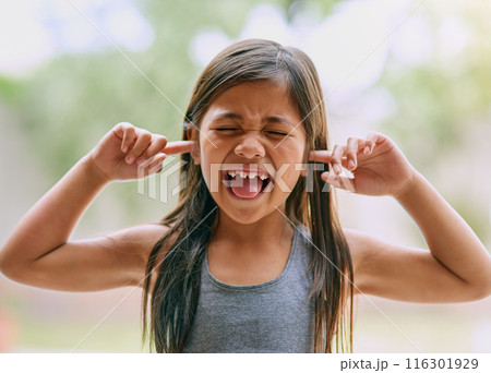 Upset, young girl and hands on ears with shouting and screaming for autism and mental health. Frustrated, female kid and burnout with stress, anxiety and fatigue from loud noise for ADHD with face Upset, young girl and hands on ears with shouting and screaming for autism and mental health. Frustrated, female kid and burnout with stress, anxiety and fatigue from loud noise for ADHD with face 116301929