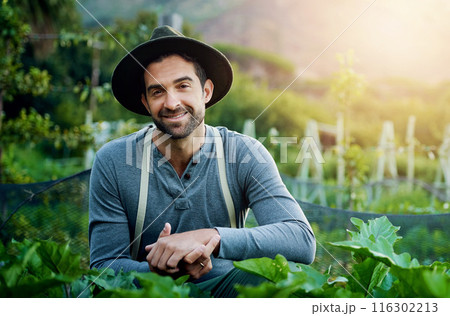 Garden, man and portrait with agriculture, sustainability and eco farming work in the countryside. Smile, farmer and field with plants, vegetables and outdoor with gardening and food growth project 116302213