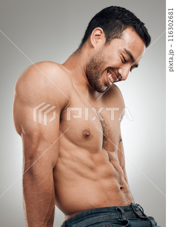 Man, thinking and confident in studio with abs or muscles, shirtless and grey background with model bodybuilder. Jeans, strong chest and Asian male person on backdrop, happy and six pack results Man, thinking and confident in studio with abs or muscles, shirtless and grey background with model bodybuilder. Jeans, strong chest and Asian male person on backdrop, happy and six pack results 116302681