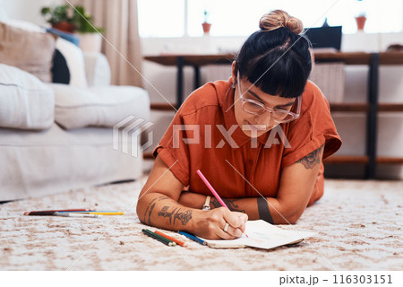 Lounge, woman and relax in home with art drawing, inspiration and creative hobby for weekend. Book, paper sketch and artist girl on apartment carpet with color pencils and design for tattoo business 116303151