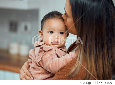 Woman, baby kiss and love in home with hug for support, child growth and development with care. Mama, newborn infant and embrace in apartment for mothers day with relationship bond and happiness 116303409