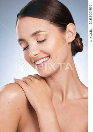 Happy woman, dermatology and beauty in studio backdrop, satisfied with results for health in blue background. Female person, face and eyes closed, cosmetic and pride for glow, skincare and wellness 116303469