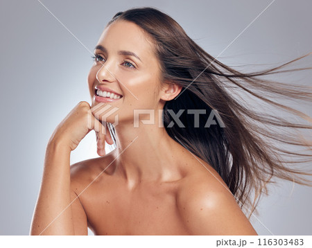 Woman, thinking and wind for hair care in studio with results, treatment and idea for cosmetics. Female person, beauty and hairstyle by white background with glow, luxury and happiness for keratin 116303483