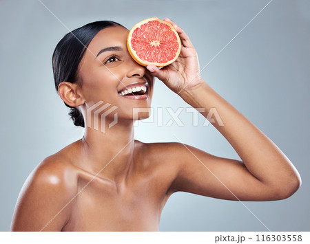 Indian woman, grapefruit and skincare for organic beauty, hand and fruit on white background. Citrus, food and vitamin c with acid for balanced skin or body care, studio and female person for detox Indian woman, grapefruit and skincare for organic beauty, hand and fruit on white background. Citrus, food and vitamin c with acid for balanced skin or body care, studio and female person for detox 116303558
