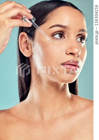 Woman, skincare and serum with dropper for beauty, product and hydration on studio background. Face oil, cosmetic and dermatology for hyaluronic acid, application and collagen facial for person Woman, skincare and serum with dropper for beauty, product and hydration on studio background. Face oil, cosmetic and dermatology for hyaluronic acid, application and collagen facial for person 116304216