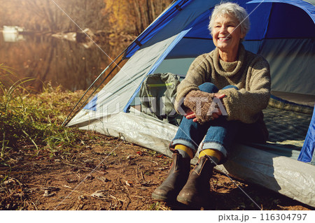Camp, mature woman and holiday in tent, smile and outdoor to enjoy nature, freedom and sunshine. Retirement, hobby and morning at campsite, happy and healthy with wellness and relaxing natural view Camp, mature woman and holiday in tent, smile and outdoor to enjoy nature, freedom and sunshine. Retirement, hobby and morning at campsite, happy and healthy with wellness and relaxing natural view 116304797