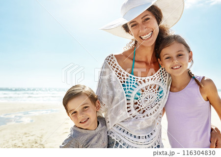 Portrait, hug or mother and kids at a beach for summer, fun and bonding in nature together. Happy family, face and woman with children at ocean for travel, journey and adventure on Miami vacation 116304830