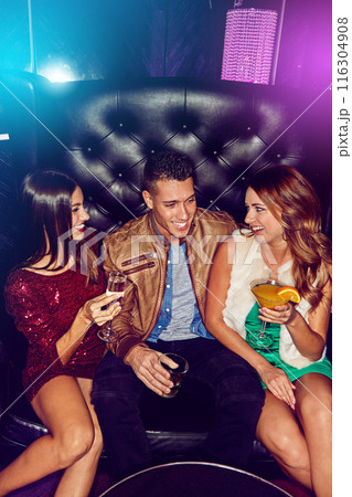 Women, man and friends in nightclub with cocktails, drink or glass for vip event, memory or reunion. Group, relax or happy people in dark disco party couch for fashion, alcohol or social celebration 116304908